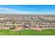 Aerial view of neighborhood near golf course with mountain views at 22728 N Arrellaga Dr, Sun City West, AZ 85375