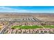 Aerial view of neighborhood, golf course and distant mountains and desert at 22728 N Arrellaga Dr, Sun City West, AZ 85375