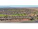 Aerial view of neighborhood, golf course, road, and mountain range at 22728 N Arrellaga Dr, Sun City West, AZ 85375