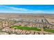 Aerial view of community with houses, golf course, and distant mountains at 22728 N Arrellaga Dr, Sun City West, AZ 85375