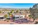 Aerial view of homes with tile roofs, desert landscape, and distant mountain views at 22728 N Arrellaga Dr, Sun City West, AZ 85375