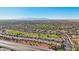 Aerial view of a community near a golf course and mountains at 22728 N Arrellaga Dr, Sun City West, AZ 85375
