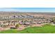 Aerial view of neighborhood near golf course with mountain views at 22728 N Arrellaga Dr, Sun City West, AZ 85375