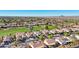 Aerial view of homes near a golf course with mountain views at 22728 N Arrellaga Dr, Sun City West, AZ 85375