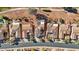 Community overview showcasing a collection of homes with tile roofs and solar panels at 22728 N Arrellaga Dr, Sun City West, AZ 85375