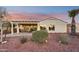 Spacious backyard patio with pergola, comfortable seating, and beautifully landscaped desert plants at 22728 N Arrellaga Dr, Sun City West, AZ 85375