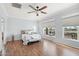 Bright bedroom with hardwood floors and views of the golf course at 22728 N Arrellaga Dr, Sun City West, AZ 85375