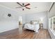 Primary bedroom with hardwood floors and access to the bathroom at 22728 N Arrellaga Dr, Sun City West, AZ 85375