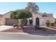 Spanish style home with a two-car garage and landscaping at 22728 N Arrellaga Dr, Sun City West, AZ 85375