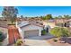 House exterior with a two-car garage and desert landscaping at 22728 N Arrellaga Dr, Sun City West, AZ 85375