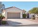 Single-story home with a two-car garage and desert landscaping at 22728 N Arrellaga Dr, Sun City West, AZ 85375
