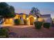 Stunning Spanish-style home with arched entryway and landscaped yard at 22728 N Arrellaga Dr, Sun City West, AZ 85375
