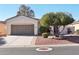 House exterior with a two-car garage and desert landscaping at 22728 N Arrellaga Dr, Sun City West, AZ 85375