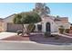 Spanish style home with a landscaped front yard and arched entryway at 22728 N Arrellaga Dr, Sun City West, AZ 85375
