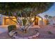 Landscaped front yard with mature tree and pathway to entry at 22728 N Arrellaga Dr, Sun City West, AZ 85375