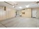 Garage offers extensive storage with built-in cabinets at 22728 N Arrellaga Dr, Sun City West, AZ 85375