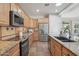 Modern kitchen with stainless steel appliances and granite countertops at 22728 N Arrellaga Dr, Sun City West, AZ 85375