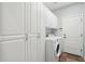 Laundry room with built-in cabinets and washer/dryer hookups at 22728 N Arrellaga Dr, Sun City West, AZ 85375
