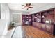 Spacious home office, hardwood floors, built-in shelving and window seat at 22728 N Arrellaga Dr, Sun City West, AZ 85375