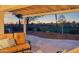Covered patio with seating area and sunset view at 22728 N Arrellaga Dr, Sun City West, AZ 85375