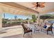 Covered patio with seating area, overlooking a golf course at 22728 N Arrellaga Dr, Sun City West, AZ 85375