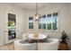 Charming breakfast nook with light wood table and seating at 25341 N 113Th Way, Scottsdale, AZ 85255