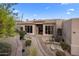 Front entrance of a beautiful home with landscaped walkway and desert plants at 25341 N 113Th Way, Scottsdale, AZ 85255