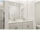 Bright bathroom featuring a double sink vanity, large mirror and a glass enclosed shower at 2685 E Santa Ynez Dr, Casa Grande, AZ 85194