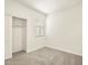 Bright, empty bedroom with neutral carpet, a window, and a closet at 2685 E Santa Ynez Dr, Casa Grande, AZ 85194