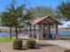 Scenic community lake with gazebo and walking paths at 2685 E Santa Ynez Dr, Casa Grande, AZ 85194