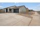 Charming single-story home with a two-car garage and stone accents on the facade at 2685 E Santa Ynez Dr, Casa Grande, AZ 85194