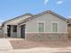 Inviting single-story home with gray stucco and stone accents on the facade at 2685 E Santa Ynez Dr, Casa Grande, AZ 85194