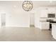 Bright kitchen features white cabinets, stainless steel appliances, and modern light fixture at 2685 E Santa Ynez Dr, Casa Grande, AZ 85194