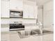 Close-up of kitchen featuring granite counters, stainless steel appliances and white cabinetry at 2685 E Santa Ynez Dr, Casa Grande, AZ 85194