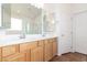 Bathroom with double sinks and large mirror at 29715 N 119Th Ln, Peoria, AZ 85383