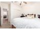 Bedroom with a queen-size bed and access to another room at 29715 N 119Th Ln, Peoria, AZ 85383