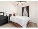 Bright bedroom with a comfortable bed and ceiling fan at 29715 N 119Th Ln, Peoria, AZ 85383