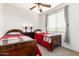 Charming bedroom with two twin beds and window coverings at 29715 N 119Th Ln, Peoria, AZ 85383