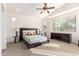 Spacious bedroom with large windows and ceiling fan at 29715 N 119Th Ln, Peoria, AZ 85383