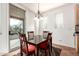 Breakfast nook with table and chairs, view to backyard at 29715 N 119Th Ln, Peoria, AZ 85383