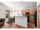 Open kitchen with granite counters and breakfast bar at 29715 N 119Th Ln, Peoria, AZ 85383