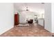 Open living area with tile floors, high ceilings, and a view to the kitchen at 29715 N 119Th Ln, Peoria, AZ 85383