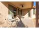Covered patio with seating area and ceiling fan at 29715 N 119Th Ln, Peoria, AZ 85383