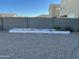 Small backyard with raised garden bed and gravel at 35262 W San Ildefanso Ave, Maricopa, AZ 85138