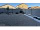 Landscaped backyard with gravel and raised garden beds at 35262 W San Ildefanso Ave, Maricopa, AZ 85138
