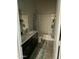 Bathroom with double vanity, bathtub, and shower at 35262 W San Ildefanso Ave, Maricopa, AZ 85138