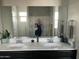 Double vanity bathroom with modern fixtures at 35262 W San Ildefanso Ave, Maricopa, AZ 85138