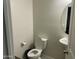Clean and simple bathroom with a round mirror at 35262 W San Ildefanso Ave, Maricopa, AZ 85138