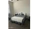 Bright bedroom with double bed, window coverings and ceiling fan at 35262 W San Ildefanso Ave, Maricopa, AZ 85138