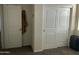 Bright bedroom with double door closet and carpet flooring at 35262 W San Ildefanso Ave, Maricopa, AZ 85138
